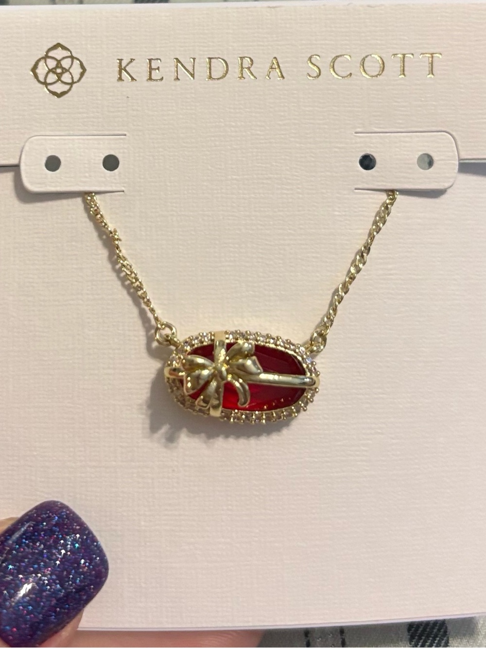 Kendra Scott Gold Necklace with Red Oval Pendant and Star Accent